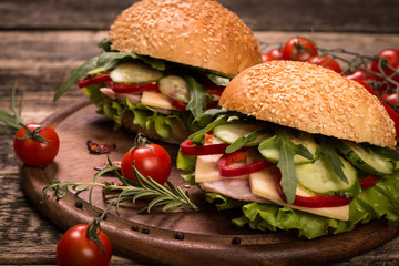 home made burger on vintage wooden background