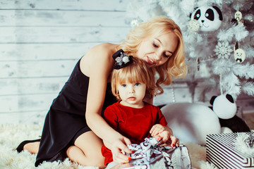 mom and daughter look for a gift