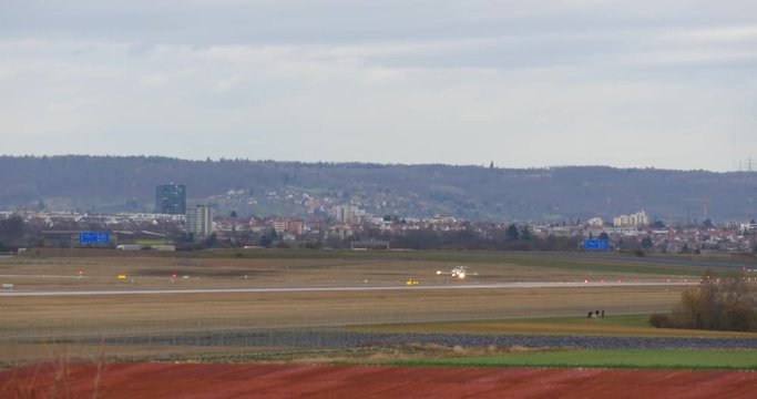 4k Passenger airplane landing on runway in airport