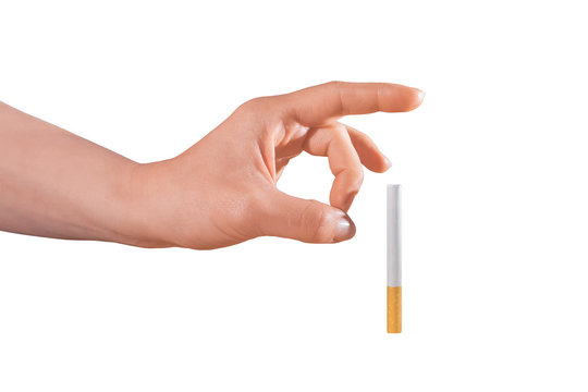 Woman trying to quit smoking by pushing it away of her isolated on white.
