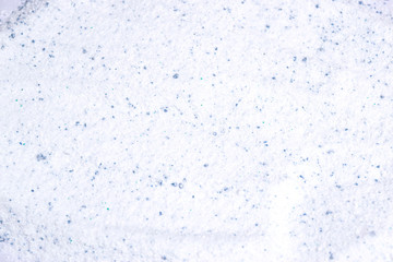 Closeup of washing powder texture background.
