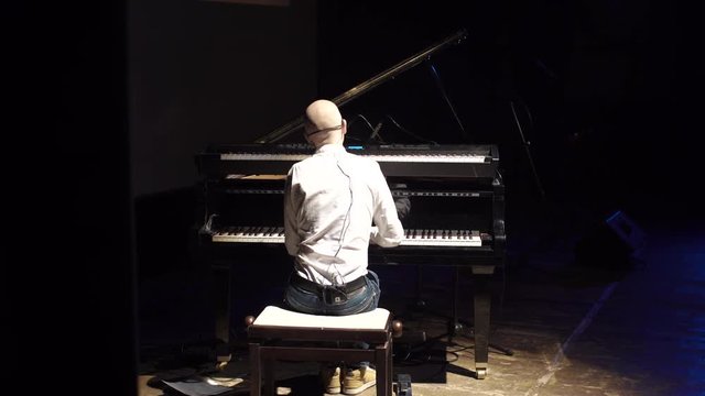 a Man Playing the Piano