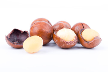 macadamia nuts on the white background, isolated