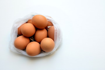 Eggs in a plastic bag, shopping eggs at the market.
