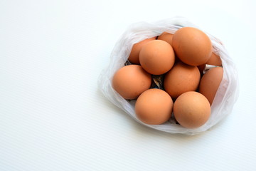 Eggs in a plastic bag, shopping eggs at the market.