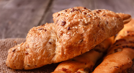 Fresh homemade small bread baguette with walnut and cheese on burlap