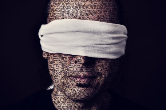 young man with a blindfold in his eyes