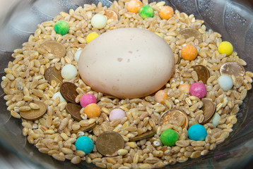 Mixing corn candy and money at customs in Bulgaria symbolizes fertility and prosperity.