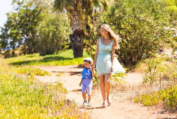 Fototapeta premium mother and son walking on nature