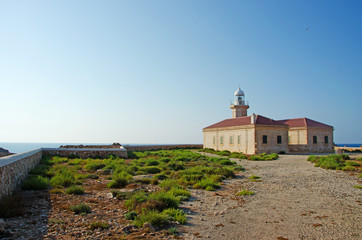 Fototapeta na wymiar Minorca, Isole Baleari, Spagna: il faro di Punta Nati il 12 luglio 2013