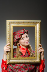 Fototapeta premium Woman in scottish clothing in art concept