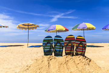 Flip flops on the sandy beach