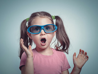 Naklejka premium excited cute little girl with 3d glasses watching 3d movie