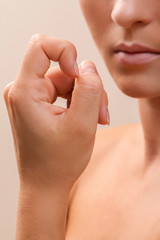 Woman bitting her fingers