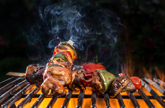 Grilled skewers and vegetables, close-up.