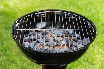 Zelfklevend Fotobehang Empty grill with red-hot briquettes. © Lukas Gojda