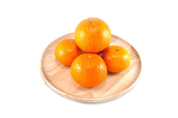 orange in a wood dish