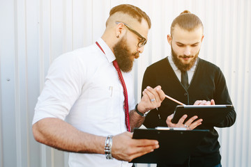 Two businessmen discussing something