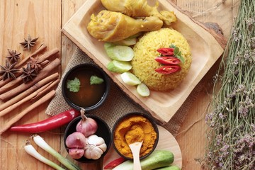 Chicken biryani with rice delicious and sauce.