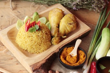 Chicken biryani with rice delicious and sauce.