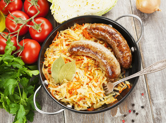 Stewed cabbage with fried sausage