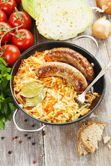 Stewed cabbage with fried sausage