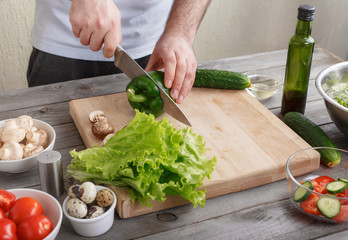 man making morning breakfast of salad