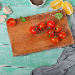 cherry tomatoes on a wooden board