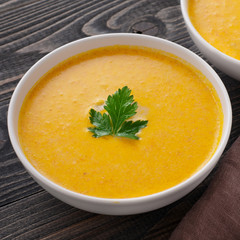 Two bowls of pumpkin soup