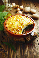 Potato casserole with meat and nettle