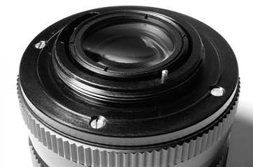 Old film DSLR lens. Metal bayonet, screw and pin aperture. Close up view. Macro. Vintage photo...