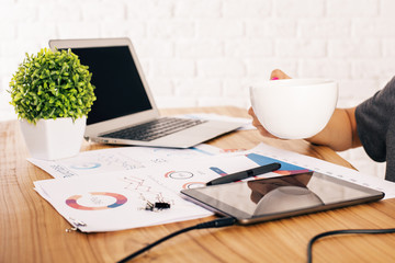 Female holding coffee mug