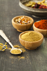 Various spices on vintage board