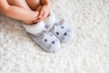 Child. Child's feet in slippers - obrazy, fototapety, plakaty