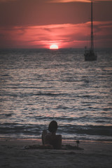 Woman Relax and watching sunset on beach