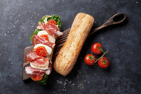 Ciabatta sandwich with salad, prosciutto and mozzarella