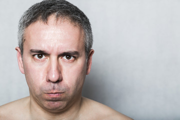 Obraz premium Portrait of angry unhappy dissatisfied aggressive middle-aged man