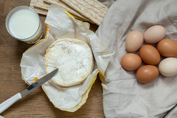Eggs, milk and butter in kitchen