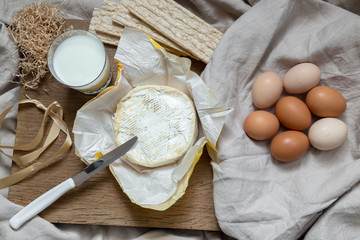 Eggs, milk and butter in kitchen
