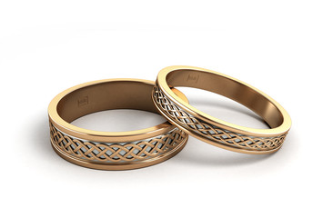 3d render Gold wedding rings engraved isolated on white