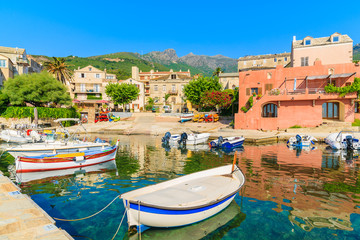 Fototapeta na wymiar Colorful fishing boats in Erbalunga port on Cap Corse, Corsica island, France