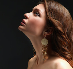 Portrait of beautiful young woman . Isolated on dark background