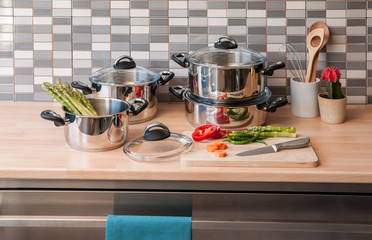 steel cookware set with modern kitchen