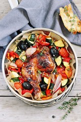 Roasted chicken leg with seasonal vegetables  . Healthy eating concept.Selective focus