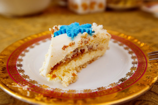Closeup image of tasty piece of cake at vintage plate on a table