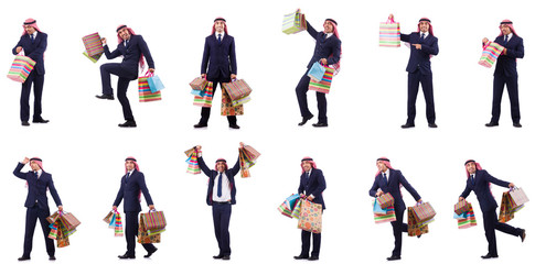 Arab man with shopping gifts on white
