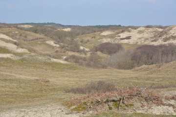 Family on bike in dunes near Camperduin in Netherlands, Noordholland