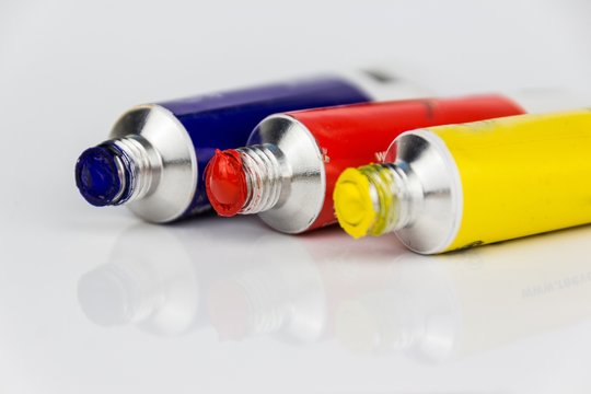 red, yellow and blue paint tubes macro