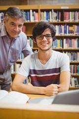 Portrait of smiling student with professor