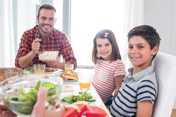 Happy family having breakfast